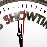 a decorative image of a clock counting down to midnight with "it's showtime" in bold text